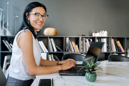 woman typing on computer