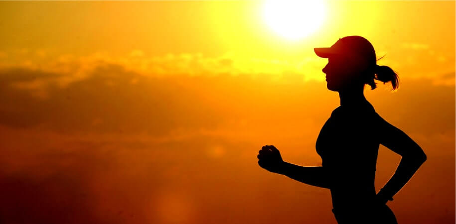 woman running by the sunset
